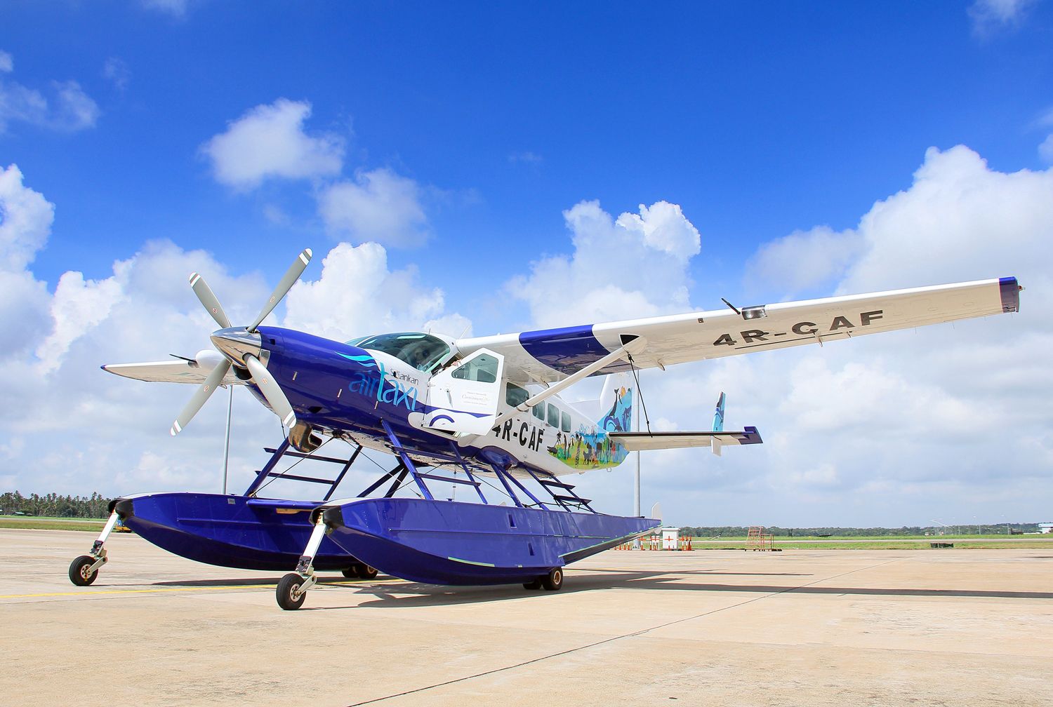 Cinnamon air seaplane parked on runway