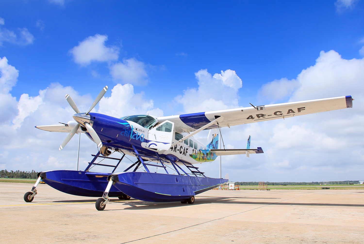 Cinnamon air seaplane parked on runway
