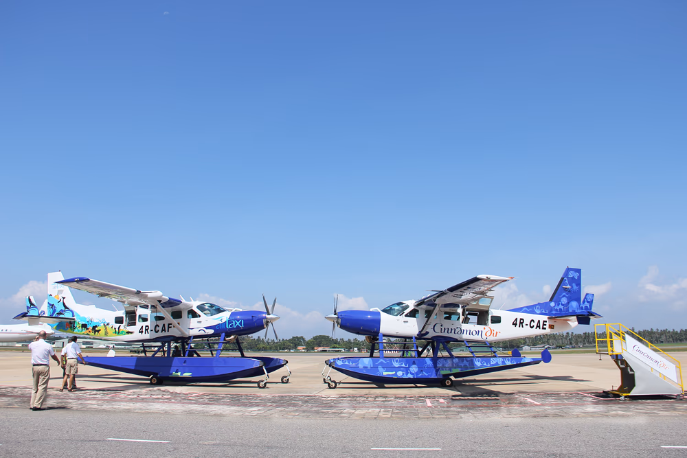 Two Cinnamon air seaplanes parked opposite each other